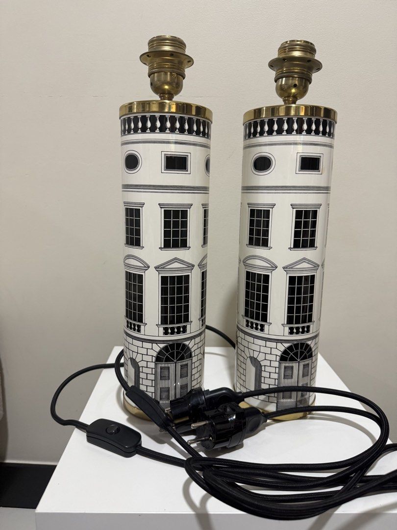 Fornasetti Architettura Table Lamps Pair (Category: Lighting) located in Mandaluyong City. Submitted by dondits4sale (Listing ID 1469983606, Image 1). Description: ✨ **AUTHENTIC FORNASETTI LAMP | PRE-LOVED DESIGNER PIECE** ✨ Looking for a unique statement piece to elevate your home? 🤍 I’m letting go of my **authentic Fornasetti lamp**, a beautiful designer piece that combines artistic architectural illustrations with an elegant pleated white lam