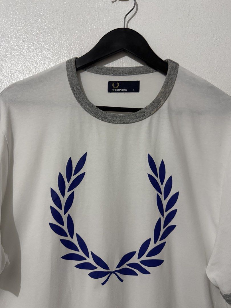 Fred Perry Big Logo Tee - White (Category: Tshirts & Polo Shirts ) located in Caloocan City. Submitted by thriftingbanana (Listing ID 1470073572, Image 2). Description: Excellent No issue Large Width 21 inches Length 28 inches.