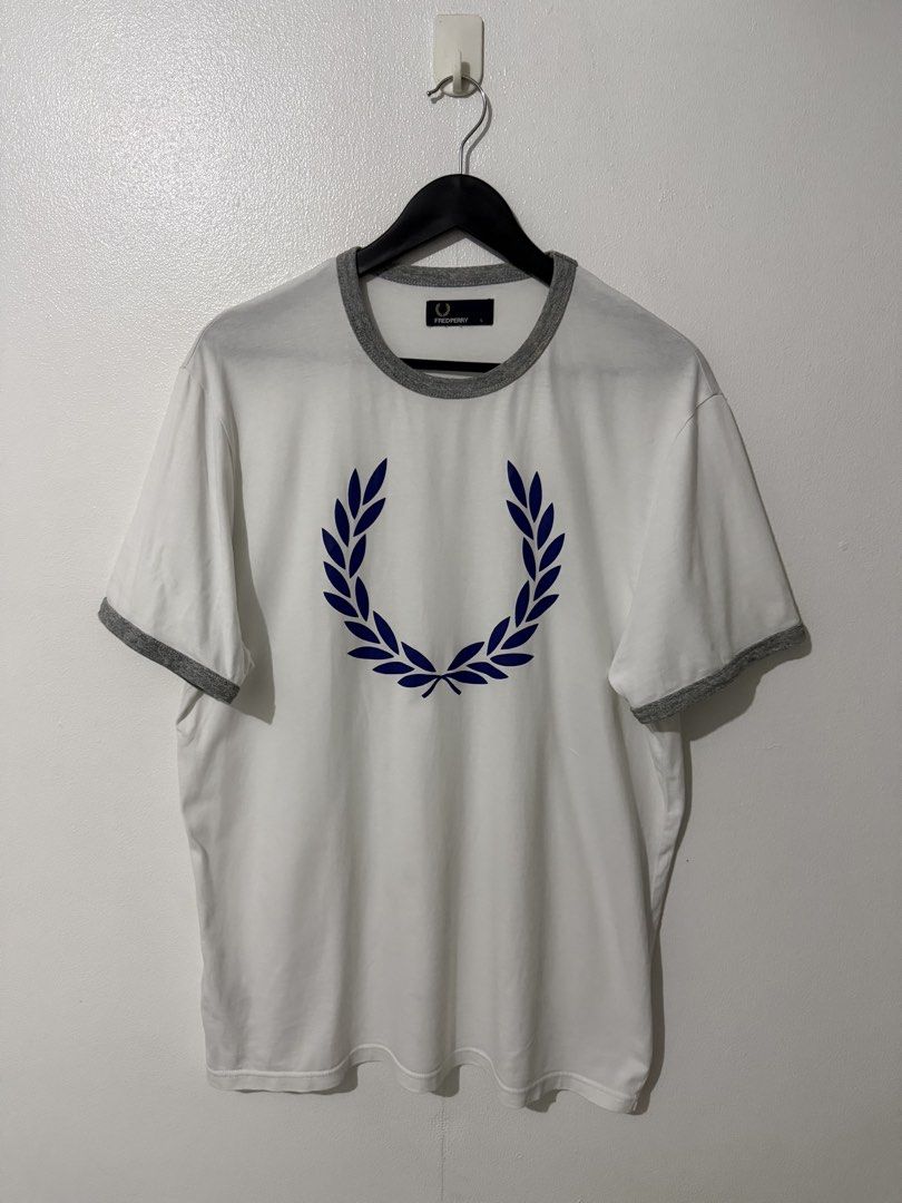 Fred Perry Big Logo Tee - White (Category: Tshirts & Polo Shirts ) located in Caloocan City. Submitted by thriftingbanana (Listing ID 1470073572, Image 1). Description: Excellent No issue Large Width 21 inches Length 28 inches.