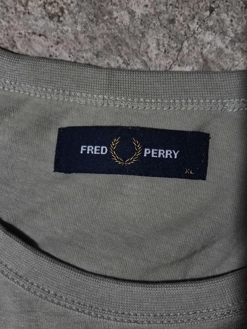 FRED PERRY RINGER TEE (Category: Tshirts & Polo Shirts ) located in Iloilo. Submitted by gooddimes (Listing ID 1470134755, Image 3). Description: Fred Perry Ringer Tee Authentic Embroidered Chest Logo Sage/Field Green Color Size on tag: XL Dimes: 22x29L Issue/s: None Color rate: 9.8/10 Like new condition ₱1,299 +sf Reminders: - All items are thrifted, please manage your expectations - Color may vary due to lighting - Please wash before using the 