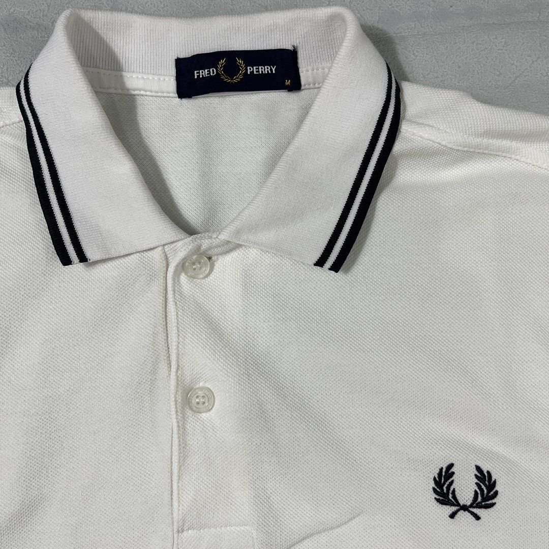 Fred Perry Twintipped White Poloshirt (Category: Tshirts & Polo Shirts ) located in Nasugbu. Submitted by janstuffs.ph (Listing ID 1470111174, Image 3). Description: 💯Legit! Size: Medium on tag Width: 19" Length: 27" Condition: 10/10 Good as new Flaw: NONE Mine: 1680 •Buyer shoulder shipping fee - ship via j&t. •Read details before purchasing..