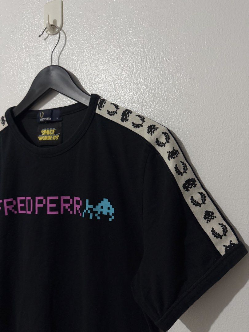 Fred Perry x Space Invaders Side Taped Tee - Black (Category: Tshirts & Polo Shirts ) located in Caloocan City. Submitted by thriftingbanana (Listing ID 1470073325, Image 2). Description: Excellent No issue Small Width 18 inches Length 27 inches.