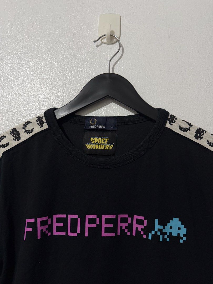 Fred Perry x Space Invaders Side Taped Tee - Black (Category: Tshirts & Polo Shirts ) located in Caloocan City. Submitted by thriftingbanana (Listing ID 1470073325, Image 3). Description: Excellent No issue Small Width 18 inches Length 27 inches.