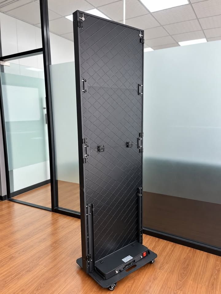 Freestanding LED Display (Category: Office Furniture & Fixtures) located in Paranaque City. Submitted by digitalconcept.corp (Listing ID 1469971689, Image 3). Description: - Material: Solid metal frame with textured acoustic fabric - Mobility: Sturdy base with caster wheels for easy repositioning - Usage: Ideal for dividing open office spaces or creating private work areas - Condition: Clean finish, ready for pickup.