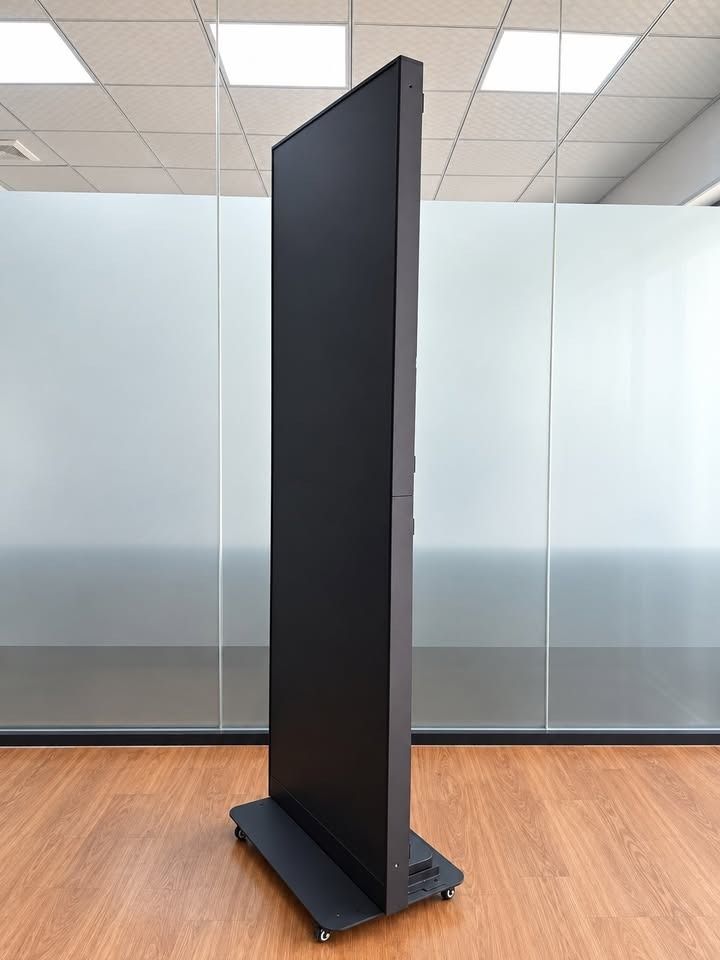 Freestanding LED Display (Category: Office Furniture & Fixtures) located in Paranaque City. Submitted by digitalconcept.corp (Listing ID 1469971689, Image 2). Description: - Material: Solid metal frame with textured acoustic fabric - Mobility: Sturdy base with caster wheels for easy repositioning - Usage: Ideal for dividing open office spaces or creating private work areas - Condition: Clean finish, ready for pickup.