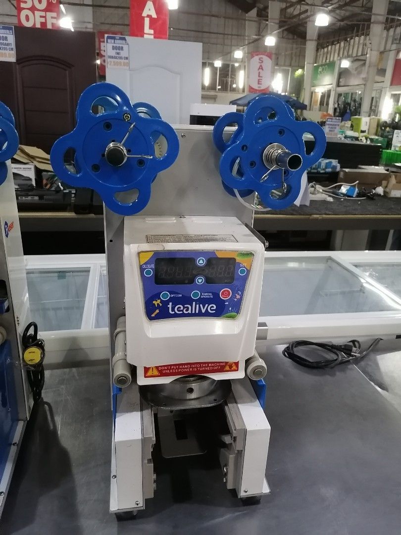 Freser ET-95SN Cup Sealing Machine USED (Category: Coffee Machines & Makers) located in Muntinlupa City. Submitted by fast_bryantorrentefernand (Listing ID 1470057945, Image 1). Description: - Model: Freser ET-95SN cup sealer machine (Made in Taiwan) - Condition: Commercial heavy-duty build, ideal for bubble tea and beverage shops - Display: Digital control panel with Tealive branding and adjustable settings for temperature, sealing time, and fil