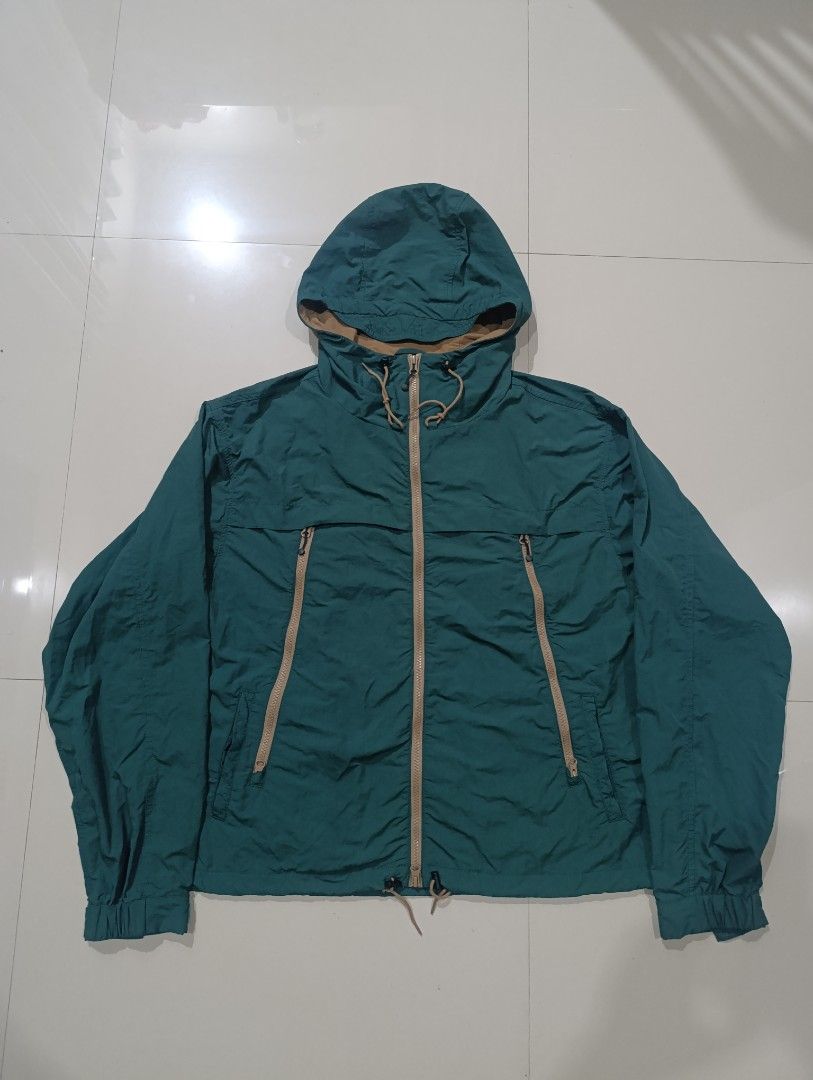 Frizmworks Mountain Wind Parka Dark Green Medium (Category: Coats, Jackets and Outerwear) located in Davao. Submitted by idioticthrifter (Listing ID 1470119917, Image 2). Description: - Brand: Frizmworks - Style: Mountain Wind Parka - Color: Dark Green with contrast tan zippers - Size: Medium - Material: 100% Nylon (Made in Vietnam) - Features: Full zip closure, adjustable hood drawstrings, angled chest zip pockets, and lower hand pockets - Produ