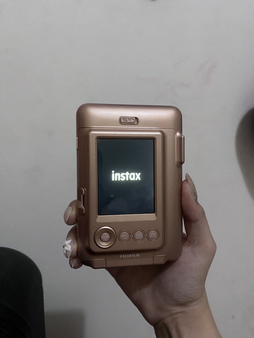 Fujifilm Instax Mini LiPlay (Category: Cameras) located in Muntinlupa City. Submitted by ell975 (Listing ID 1470085534, Image 3). Description: The Fujifilm instax mini LiPlay is a hybrid digital instant camera and smartphone printer that lets you take photos digitally, review them on an LCD screen, choose what to print, and even add sound or use your phone as a remote • Holds about 45 images in internal memory (expandable via microSD/microSDHC ca
