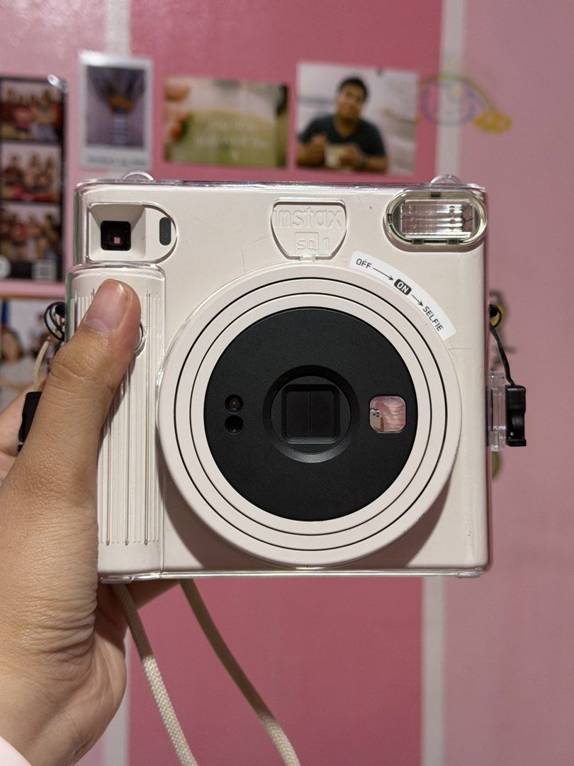 Fujifilm Instax Square SQ1 Instant Camera (Category: Cameras) located in Apalit. Submitted by ear_moon (Listing ID 1470103742, Image 1). Description: PRELOVED INSTAX SQ1 FOR SALE! 💗 Price: ₱4,800 🎁 Freebies: Camera case + strap 📍 Pampanga 💌 Message me for inquiries!.