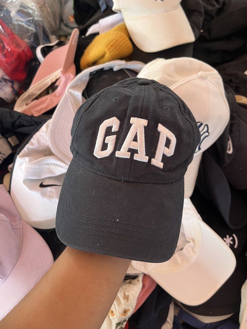 GAP Black Embroidered Baseball Cap (Category: Caps & Hats) located in Pilar. Submitted by fast-flip-ni-miko. (Listing ID 1469989422, Image 1). Description: - Color: Classic Black with bold white embroidered GAP lettering - Fit: Adjustable strap at the back with stylish white stripes - Details: Features a small GAP label tag on the strap and standard interior brand tag - Style: Solid everyday cap that matches any casual outfit - Condition: Brand n