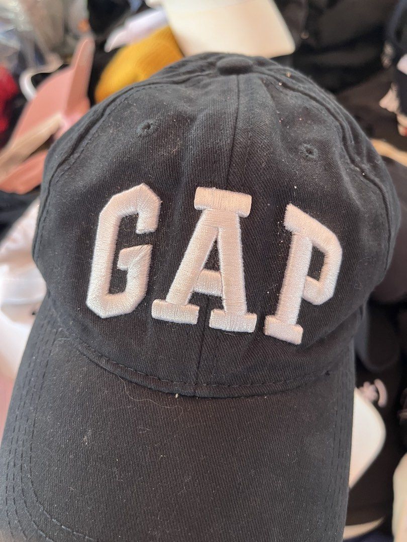 GAP Black Embroidered Baseball Cap (Category: Caps & Hats) located in Pilar. Submitted by fast-flip-ni-miko. (Listing ID 1469989422, Image 2). Description: - Color: Classic Black with bold white embroidered GAP lettering - Fit: Adjustable strap at the back with stylish white stripes - Details: Features a small GAP label tag on the strap and standard interior brand tag - Style: Solid everyday cap that matches any casual outfit - Condition: Brand n