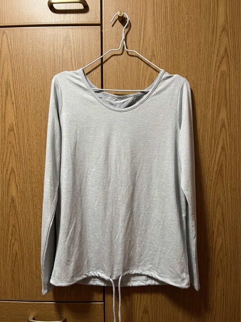 GapFit Brushed Tech Jersey Long Sleeve Top Grey S (Category: Longsleeves) located in Marikina City. Submitted by sakura_07 (Listing ID 1470136876, Image 1). Description: - Brand: GapFit - Item: Long sleeve active top - Color: Grey - Size: Small - Material: Soft brushed tech jersey - Features: Round neckline, cinched drawstring hem, and open keyhole back cutout - Condition: Clean, lightweight, and comfortable for workouts or casual days.