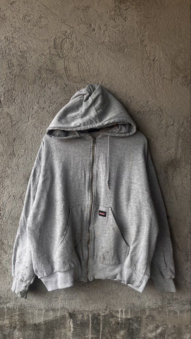 Genuine Dickies Grey Zip-Up Hoodie (Category: Hoodies) located in Cabuyao City. Submitted by bulandos (Listing ID 1470033259, Image 1). Description: Grey zip-up hoodie from Genuine Dickies. Front pouch pockets, drawstring hood, ribbed cuffs and hem. Thermal waffle lining inside. Has some visible stains and wear marks on the sleeves and pocket area. Solid everyday piece..