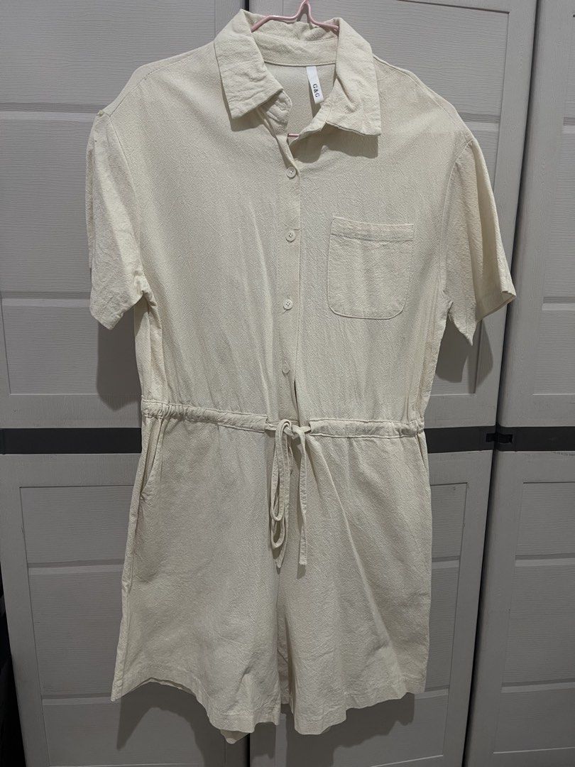 G&G Cream Short Sleeve Button-Up Romper (Category: Rompers) located in Quezon City. Submitted by zntinycloset (Listing ID 1469974160, Image 1). Description: - Brand: G&G - Color: Cream - Style: Short sleeve romper / one-piece - Details: Collared neckline, button-front closure, single chest pocket, and back yoke with pleat detailing - Waist: Elastic waistband with an adjustable drawstring tie - Condition: Clean fabric texture throughout - Perfect 