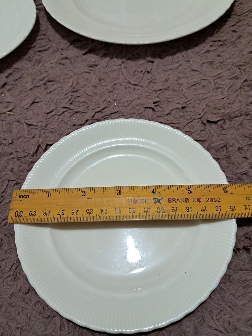 Gift set (Category: Dinnerware & Cutlery) located in Cavite. Submitted by secretjapansurplus (Listing ID 1469982660, Image 3). Description: Brand New White Ceramic Ribbed Plate Set (6 Pieces) • Set Composition: Includes 1 large serving plate (9") and 5 matching smaller side plates (6"). • Design & Style: Classic minimalist look in solid off-white ceramic featuring elegant vertical ribbed borders and subtly scalloped edges. • Condition: Brand new 