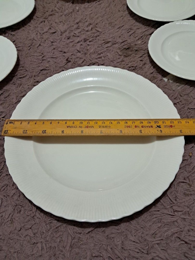 Gift set (Category: Dinnerware & Cutlery) located in Cavite. Submitted by secretjapansurplus (Listing ID 1469982660, Image 2). Description: Brand New White Ceramic Ribbed Plate Set (6 Pieces) • Set Composition: Includes 1 large serving plate (9") and 5 matching smaller side plates (6"). • Design & Style: Classic minimalist look in solid off-white ceramic featuring elegant vertical ribbed borders and subtly scalloped edges. • Condition: Brand new 