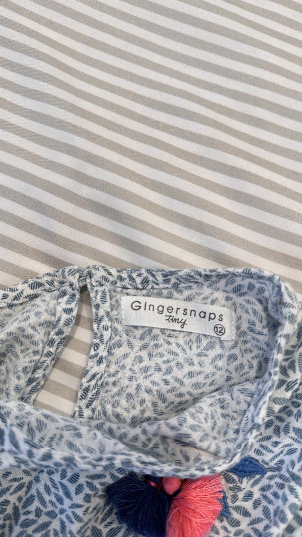 Gingersnaps Tiny Blue Leaf Print Romper Size 12 (Category: Babies & Kids Fashion) located in General Trias. Submitted by dphazel (Listing ID 1470049536, Image 3). Description: - Brand/Style: Gingersnaps Tiny blue & white leaf print romper - Size: 12 months (best fit 9-18mos) - Features: Adorable embroidered toucan patch with colorful tassels, elastic waist, and short sleeves - Convenience: Snap buttons down the legs for quick and easy diaper chan