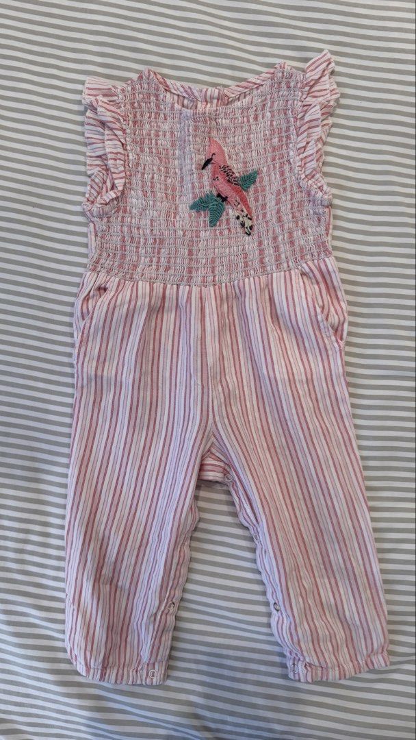 Gingersnaps Tiny Pink Striped Smocked Bird Romper Size 12 (Category: Babies & Kids Fashion) located in General Trias. Submitted by dphazel (Listing ID 1470044996, Image 1). Description: - Brand: Gingersnaps Tiny - Size: 12 Months (best fit 9-12mos) - Color/Pattern: Pink and white striped - Details: Smocked bodice with embroidered bird and leaf design, ruffle shoulder trim, and side pockets - Convenience: Back button closure and snap buttons along