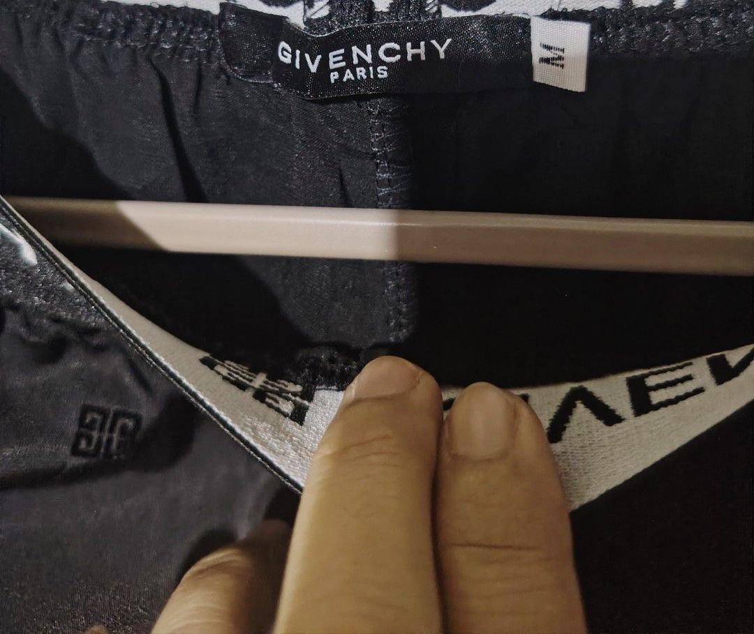 Givenchy Paris Oversized Fit Black Trousers Size M (Category: Trousers) located in Santa Rosa. Submitted by RRRR0520 (Listing ID 1470060318, Image 3). Description: - Brand: Givenchy Paris - Item: Oversized Monogram Trousers - Color: Black with all-over monogram pattern - Size: M - Material: 100% Cotton (Made in Portugal) - Waistband: Elastic with bold Givenchy lettering and logo - Fit: Relaxed wide-leg - Features: Practical side pockets - Details
