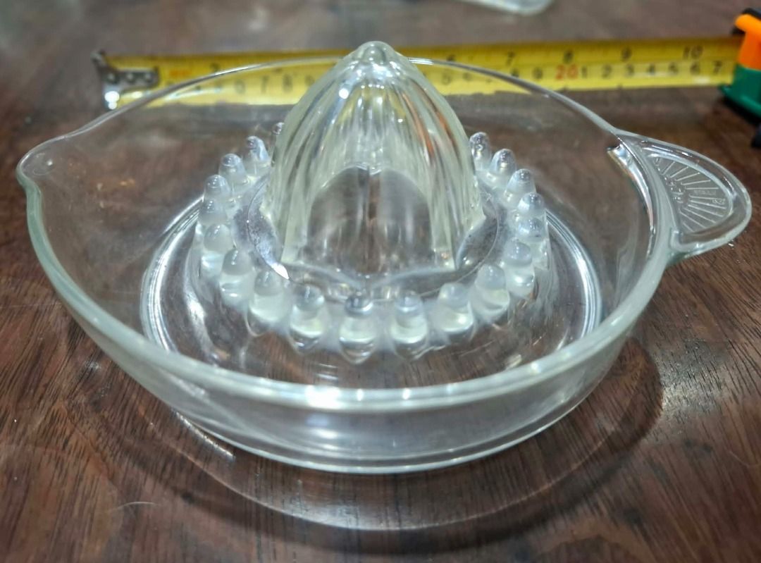 Glass Citrus Juicer (Category: Other Kitchenware & Tableware) located in Pasig City. Submitted by dripcounty (Listing ID 1470026225, Image 1). Description: Glass Citrus Juicer ₱100 Bought in the Philippines Condition: Good / preloved Clear glass manual citrus juicer with reamer, pouring spout and side handle. Actual item shown in photos. Delivery fee shouldered by buyer (Lalamove / other courier). Item price excludes delivery. Payment via cash / 