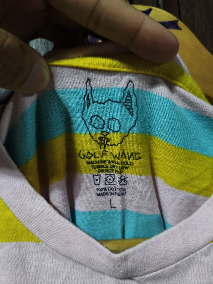 Golf Wang Striped T-Shirt (Category: Tshirts & Polo Shirts ) located in Bayambang. Submitted by rajuergui76226 (Listing ID 1470008195, Image 2). Description: - Brand: Golf Wang - Item: Multicolor Striped T-Shirt - Colorway: Turquoise, yellow, white, and pink stripes with blue 'GOLF' chest graphic - Size: L (Pit-to-length: approx. 20 x 27.5 inches) - Material: 100% Cotton, Made in Peru - Condition: Clean fabric, great overall appearance with zero 