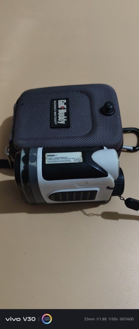 GolfBuddy LR7 Laser Rangefinder with Case (Category: Golf) located in Manila. Submitted by roblazo25 (Listing ID 1469973857, Image 3). Description: - Model: GolfBuddy LR7 laser rangefinder - Color: Sleek white and black - Performance: Measures distances accurately on the course - Portability: Compact size that easily fits in a pocket or bag - Extras: Includes original grey protective carrying case with carabiner clip and attached strap - Conditio