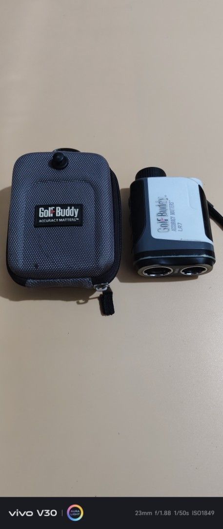 GolfBuddy LR7 Laser Rangefinder with Case (Category: Golf) located in Manila. Submitted by roblazo25 (Listing ID 1469973857, Image 1). Description: - Model: GolfBuddy LR7 laser rangefinder - Color: Sleek white and black - Performance: Measures distances accurately on the course - Portability: Compact size that easily fits in a pocket or bag - Extras: Includes original grey protective carrying case with carabiner clip and attached strap - Conditio