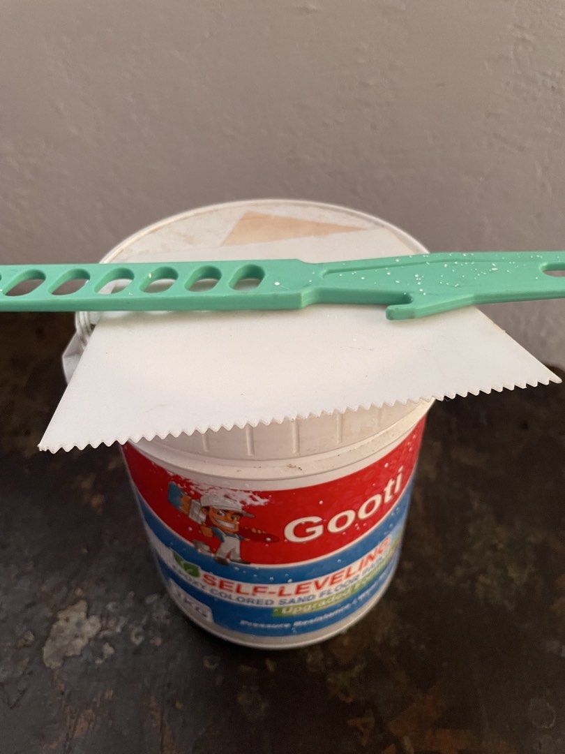 Gooti Self-Leveling Epoxy Colored Sand Floor Paint 1KG (Category: Construction & Building Materials) located in Binangonan. Submitted by shianloves33961 (Listing ID 1470060346, Image 2). Description: Gooti self-leveling epoxy colored sand floor paint, 1kg tub. Upgraded formula with pressure and wear resistance. Includes a notched plastic spreader and a green mixing stick right on top. Unopened tub, clean label, ready for your next DIY flooring pr