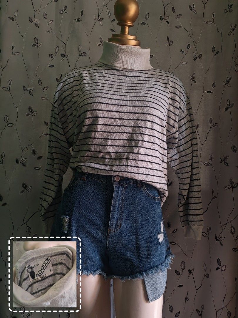 Goouch striped turtleneck long sleeve sweater (Category: Longsleeves) located in Caloocan City. Submitted by _misskaye (Listing ID 1470042473, Image 1). Description: - Brand: Goouch - Style: Vintage turtleneck sweater with horizontal stripes - Color: Cream base with thin black stripes - Size: Small (tag on collar) - Material: Warm and comfortable cotton blend - Features: Long sleeves, ribbed high neck - Condition/Use: Great piece for layering dur