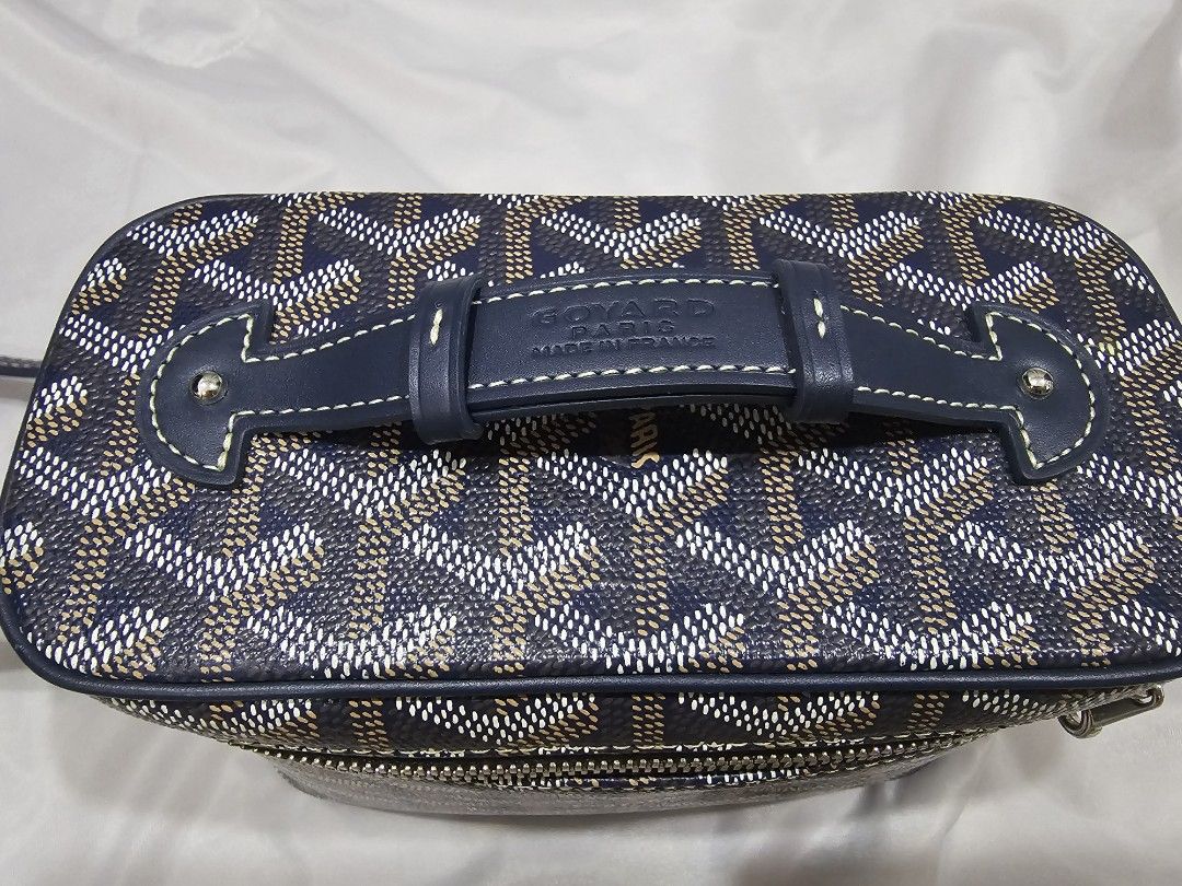 Goyard Mini Muse (Category: Luxury Bags & Wallets) located in Makati City. Submitted by stephanie48_whale (Listing ID 1470126824, Image 2). Description: Moving back sales , no dust bag , no cert , AUTHENTIC NO FAKE , slightly nego for serious buyer - Brand: Goyard Vanity Bag - Color: Classic Navy Blue with signature chevron print - Design: Structured boxy shape with silver-tone hardware and wraparound zipper - Versatility: Includes a top handle a