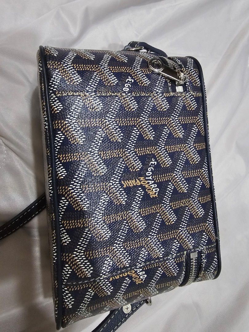 Goyard Mini Muse (Category: Luxury Bags & Wallets) located in Makati City. Submitted by stephanie48_whale (Listing ID 1470126824, Image 3). Description: Moving back sales , no dust bag , no cert , AUTHENTIC NO FAKE , slightly nego for serious buyer - Brand: Goyard Vanity Bag - Color: Classic Navy Blue with signature chevron print - Design: Structured boxy shape with silver-tone hardware and wraparound zipper - Versatility: Includes a top handle a