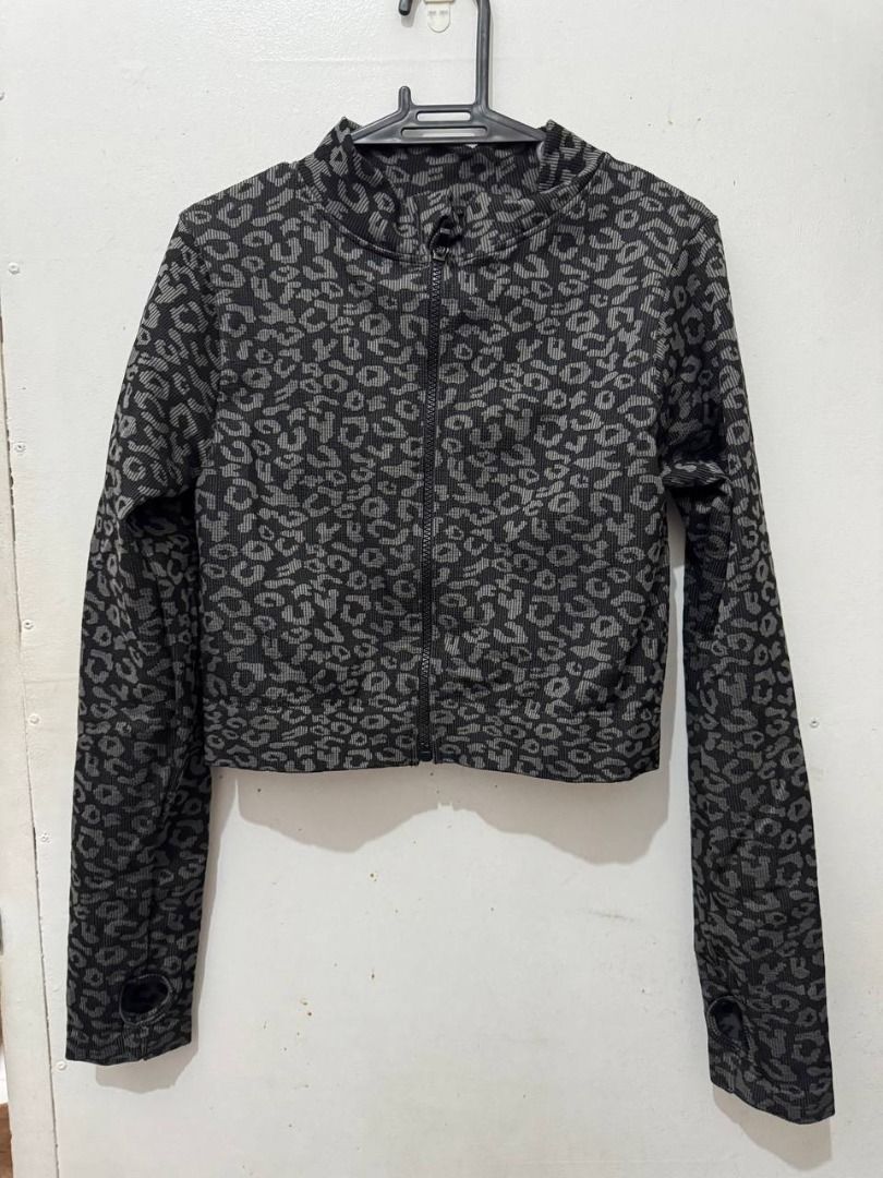 Grey Leopard Print Activewear Zip Jacket (Category: Coats, Jackets and Outerwear) located in Santa Rosa. Submitted by sherikasstuff (Listing ID 1469958313, Image 1). Description: - Style: Grey and black animal print athletic jacket - Size: XXL but can fit XS-S - Design: Full zip front with a round collar - Features: Long sleeves with convenient thumb holes at the cuffs - Material: Comfortable ribbed knit blend (54% polyamide, 34% polyester, 12% e