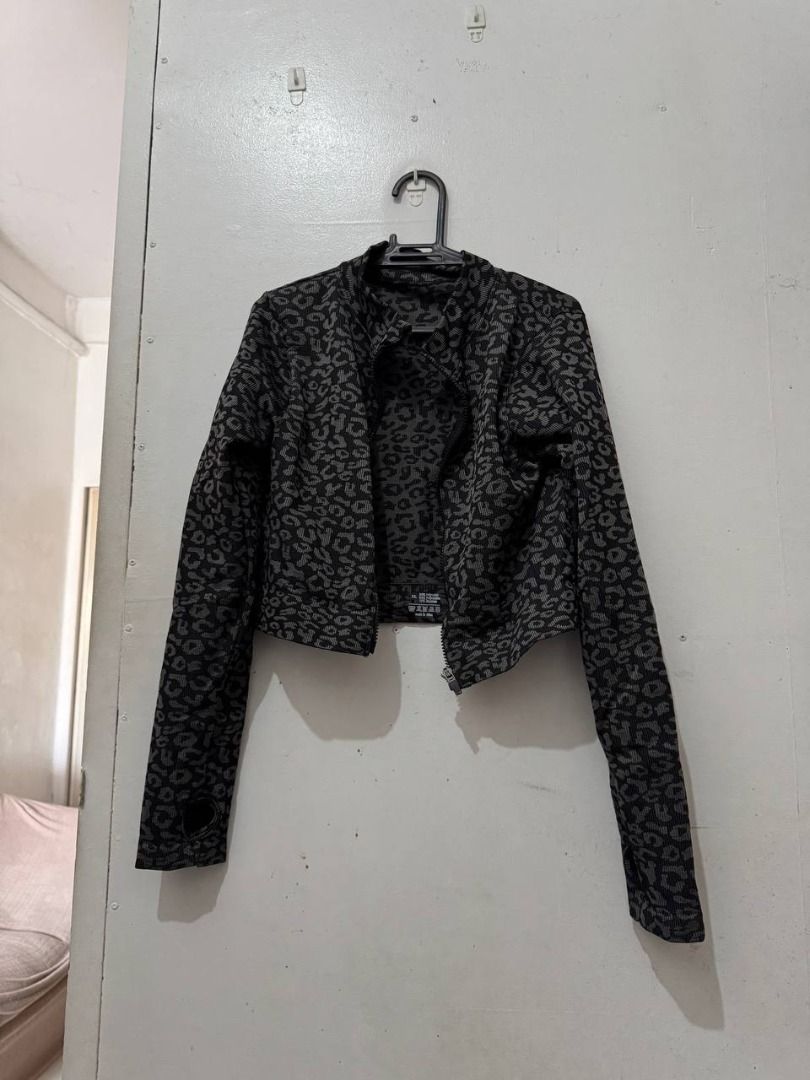 Grey Leopard Print Activewear Zip Jacket (Category: Coats, Jackets and Outerwear) located in Santa Rosa. Submitted by sherikasstuff (Listing ID 1469958313, Image 2). Description: - Style: Grey and black animal print athletic jacket - Size: XXL but can fit XS-S - Design: Full zip front with a round collar - Features: Long sleeves with convenient thumb holes at the cuffs - Material: Comfortable ribbed knit blend (54% polyamide, 34% polyester, 12% e