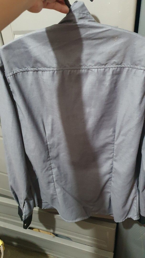 Grey long sleeve polo elegant design (Category: Formal Shirts) located in Manila. Submitted by finn8 (Listing ID 1469997638, Image 3). Description: - Size: XL - Color: Solid grey - Closure: Snap buttons with unique design - Details: Standard collar, long sleeves - Condition: Excellent, ready to wear meetup xentro mall sta ana manila.