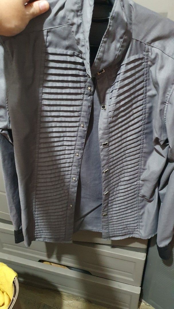 Grey long sleeve polo elegant design (Category: Formal Shirts) located in Manila. Submitted by finn8 (Listing ID 1469997638, Image 1). Description: - Size: XL - Color: Solid grey - Closure: Snap buttons with unique design - Details: Standard collar, long sleeves - Condition: Excellent, ready to wear meetup xentro mall sta ana manila.