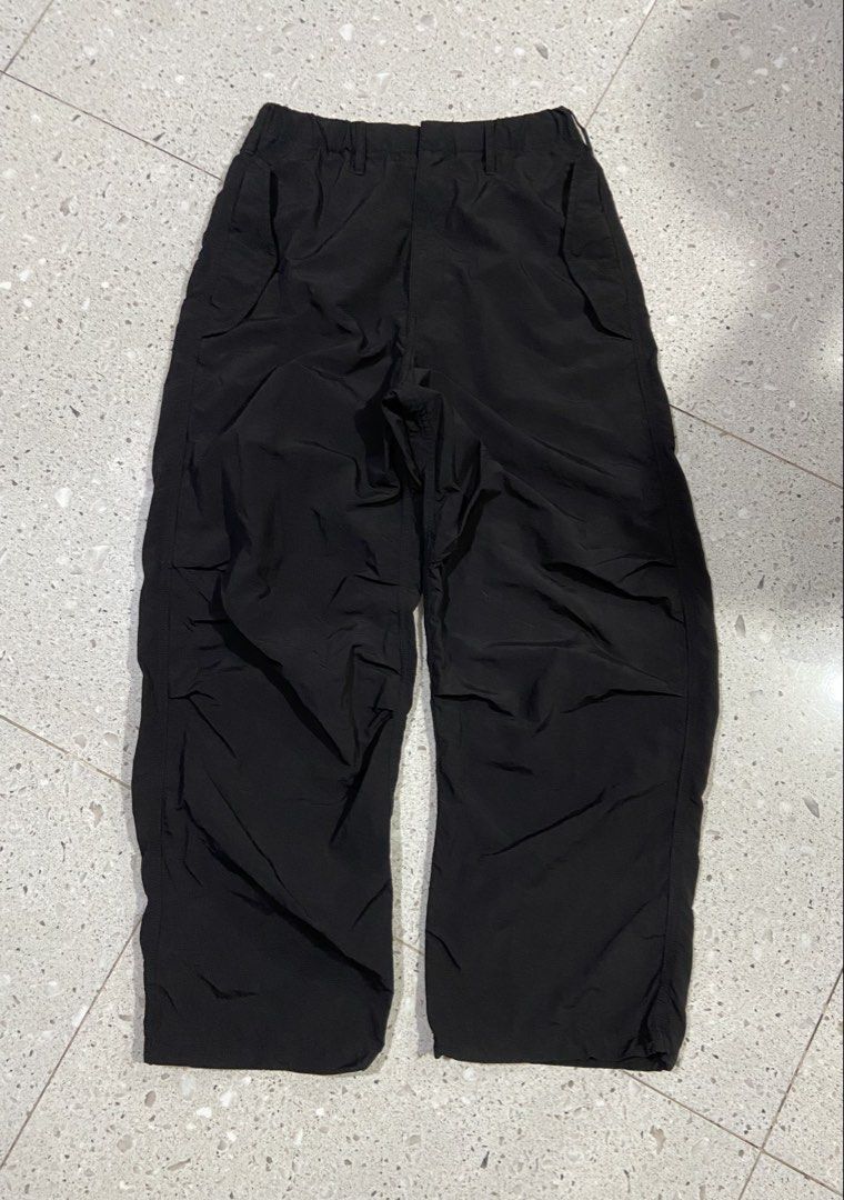 GU Black Nylon Parachute Pants Size S (Category: Trousers) located in Calumpit. Submitted by Ketchi (Listing ID 1470063633, Image 1). Description: - Brand: GU - Color: Black - Size: S (fits 165/72A) - Material: 100% lightweight nylon - Features: Elastic waistband, adjustable drawstrings at the cuffs for styling - Origin: Made in Indonesia - Condition: Clean, zero flaws.