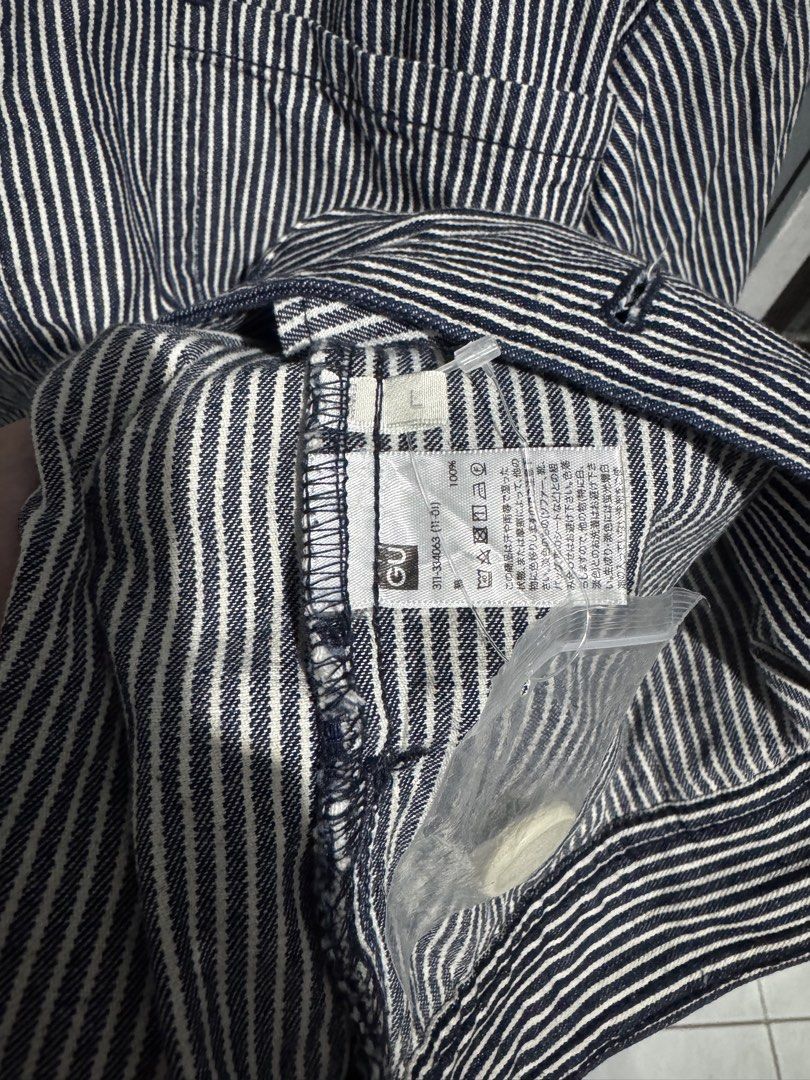 GU Chef Hickory Jacket (Category: Coats, Jackets and Outerwear) located in Manila. Submitted by JustinsCloset (Listing ID 1470051159, Image 3). Description: - Brand: GU - Style: Chef Hickory Jacket - Color: Navy blue - Size: L - Material: 100% cotton - Features: Pointed collar, button-up closure, two front chest pockets, and buttoned cuffs - Inclusion: Comes with an extra replacement button - Condition: Excellent / Like new 22x28 Nego for sure bu