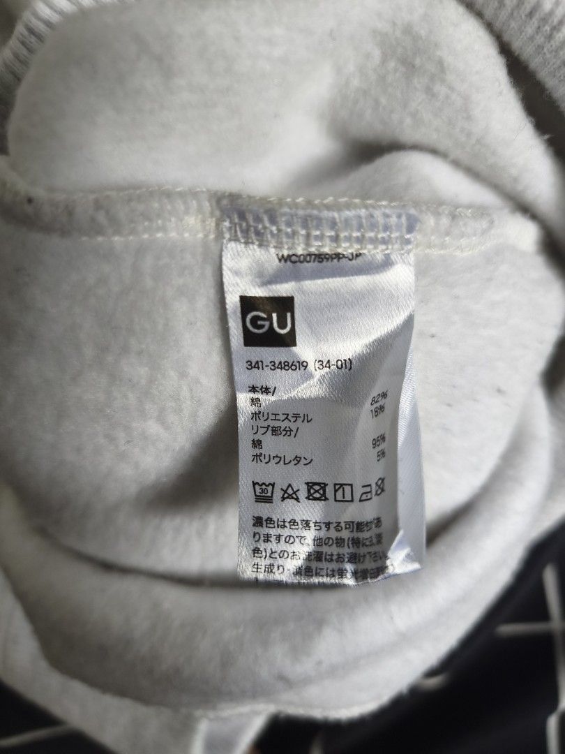 GU Q-zip Heather Grey Sweatshirt (Category: Coats, Jackets and Outerwear) located in Manila. Submitted by gelog2 (Listing ID 1469956465, Image 2). Description: - Brand: GU - Style: Quarter-zip sweatshirt with high collar and metal zipper pull - Color: Heather grey (vibrant and clean) - Material: Soft cotton blend with ribbed cuffs and hem - Features: Practical side pockets - Size: 26.5 inches (length) x 23 inches (width) - Condition: 10/10, flawl