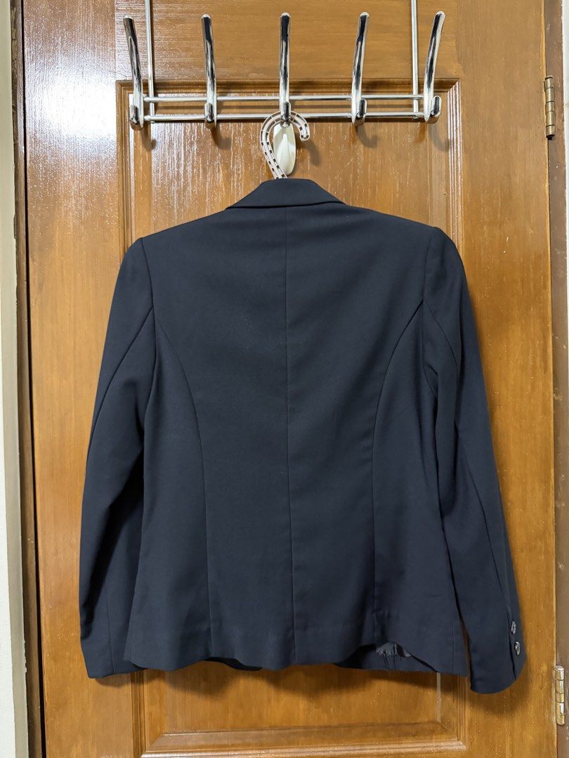 GU Women’s Tailored Blazer Size S (Category: Coats, Jackets and Outerwear) located in Bulacan. Submitted by lilthingsco (Listing ID 1470115231, Image 3). Description: - Brand/Model: GU tailored blazer - Size: Small - Color: Dark Navy Blue (almost black) - Closure & Pockets: Single-button front with functional flap pockets - Details: Chic button cuffs and back center seam for a flattering, fitted silhouette - Interior: Fully lined for comfort - Ma