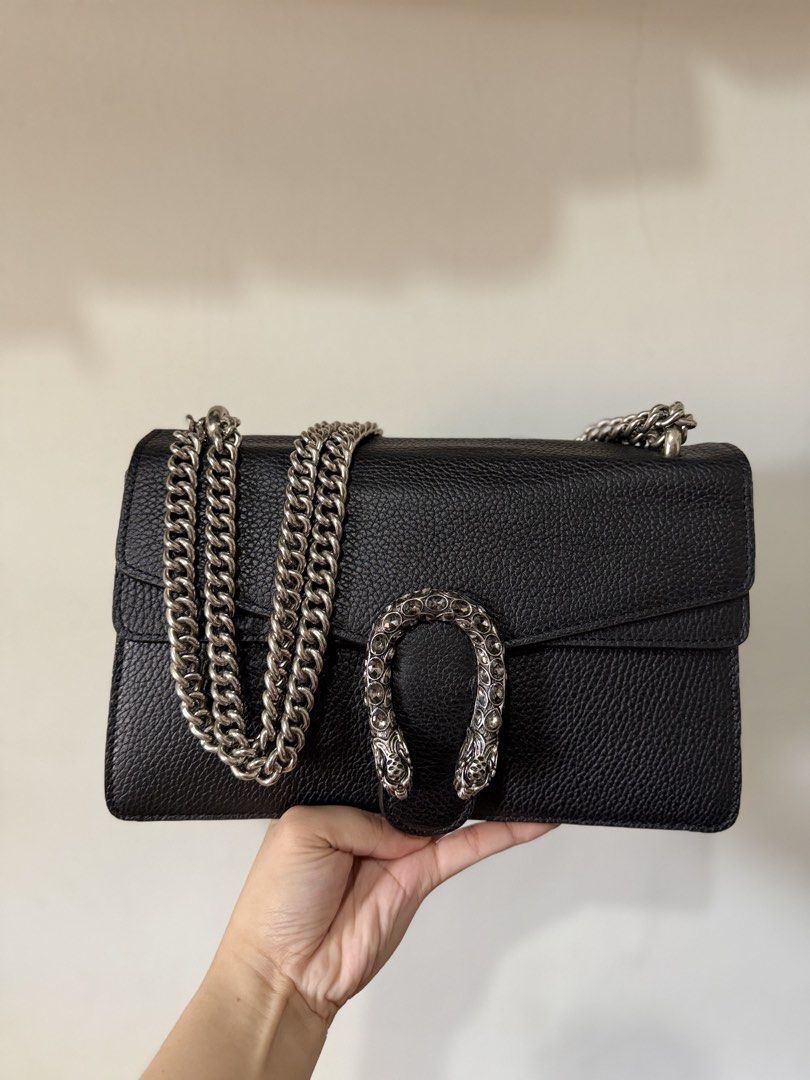 Gucci Black Leather Dionysus Shoulder Bag (Category: Luxury Bags & Wallets) located in Lipa City. Submitted by asleeeh (Listing ID 1470000077, Image 2). Description: -Coded Gucci Dionysus shoulder bag in black grained leather -With dust bag, hang tag, care card - Signature crystal-encrusted textured horseshoe closure - Versatile sliding antique silver-toned chain strap (wear double or crossbody) - Clean light-colored fabric interior with leather 