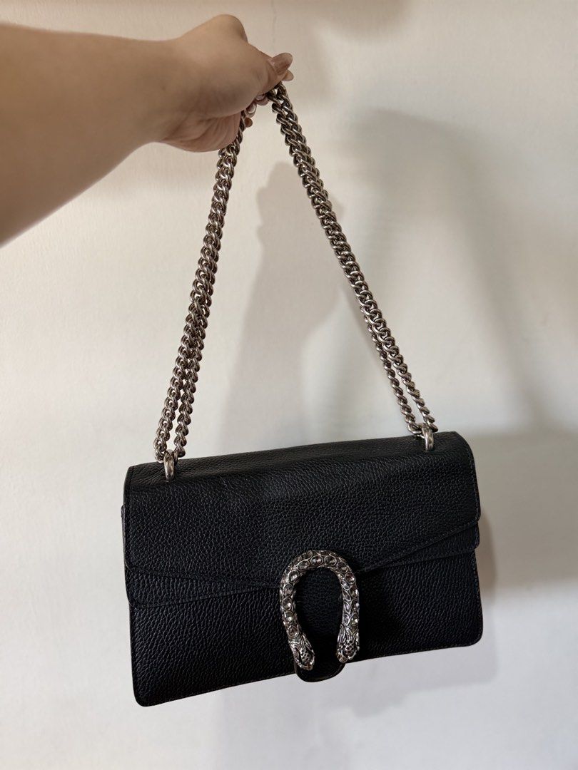 Gucci Black Leather Dionysus Shoulder Bag (Category: Luxury Bags & Wallets) located in Lipa City. Submitted by asleeeh (Listing ID 1470000077, Image 1). Description: -Coded Gucci Dionysus shoulder bag in black grained leather -With dust bag, hang tag, care card - Signature crystal-encrusted textured horseshoe closure - Versatile sliding antique silver-toned chain strap (wear double or crossbody) - Clean light-colored fabric interior with leather 