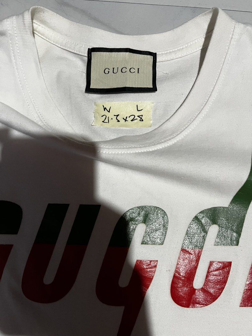 Gucci Blade Logo White T-Shirt (Category: Tshirts & Polo Shirts ) located in Cavite. Submitted by christianzuuu (Listing ID 1469957234, Image 3). Description: - Off - Brand: Gucci - Color: White with red and green blade logo graphic - Material: 100% Cotton, Made in Italy - Fit: Classic crew neck, short sleeves, regular fit - Measurements: 21.5 inches width x 28 inches length - Condition: Clean, excellent overall condition - Details: Includes insi