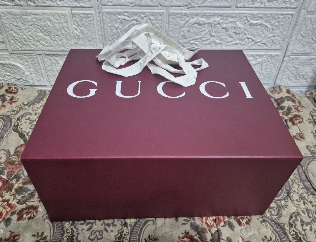 Gucci Box (Category: Luxury Accessories) located in Pasig City. Submitted by luxbox_acc (Listing ID 1470104981, Image 1). Description: Square box Good for small to medium bags with ribbon with small dots inside the box.