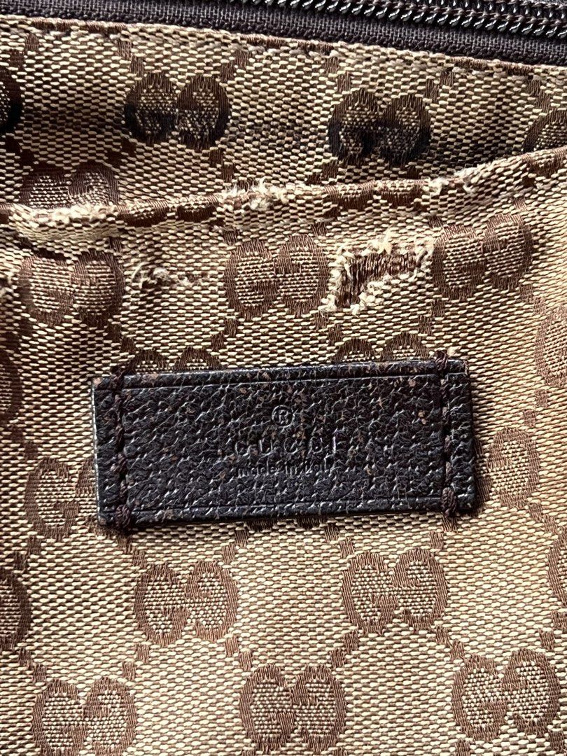 Gucci GG Monogram Web Stripe Tote Bag (Category: Luxury Bags & Wallets) located in Manila. Submitted by mightylion-ce6ea7 (Listing ID 1470032246, Image 3). Description: - Gucci tote bag with classic GG monogram canvas - Features premium brown leather trim and base - Signature red and green web stripe fabric handles - Secure zip closure across the top - Interior leather branding tag included - Condition: Shows visible wear on the handles, edges, a