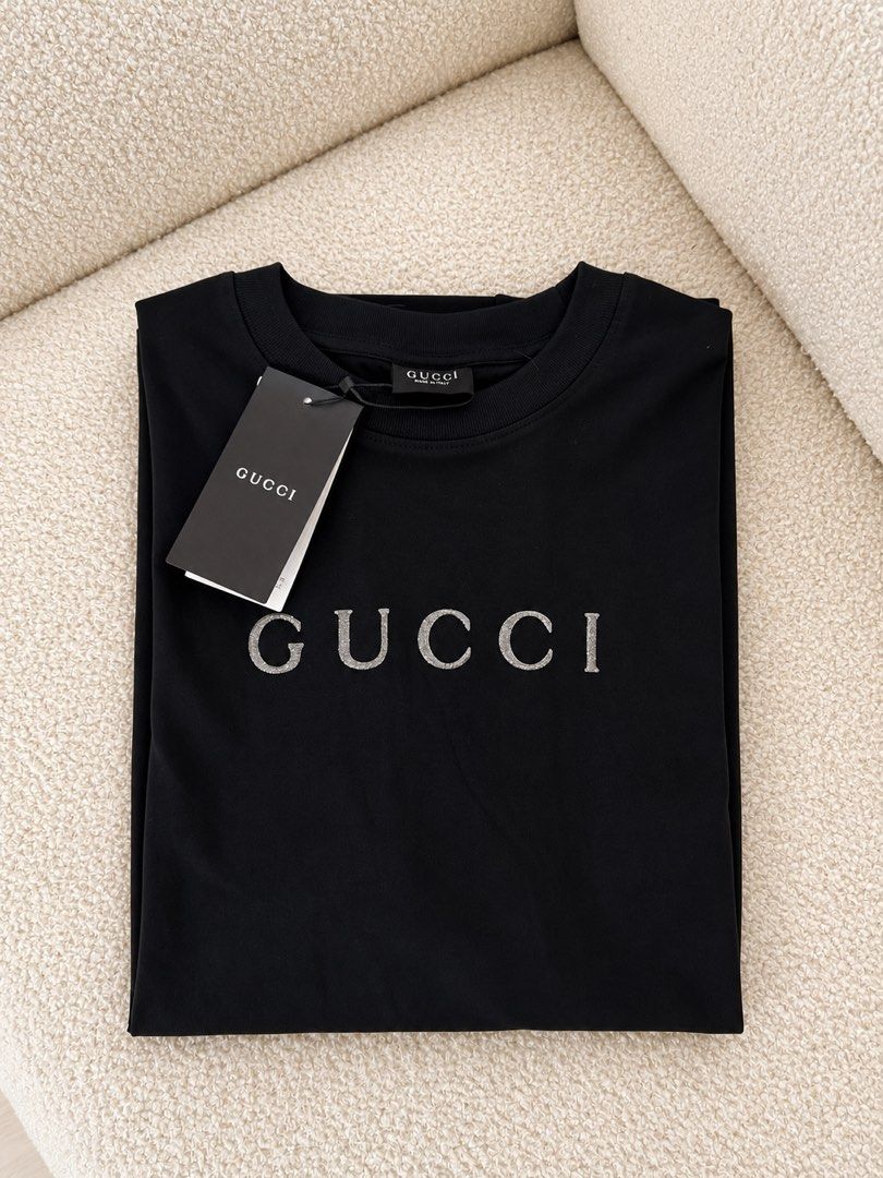 ⚜️Gucci glitter Black tshirt (Category: Luxury Apparel) located in Makati City. Submitted by 90sangel (Listing ID 1470017029, Image 3). Description: with gucci paperbag.