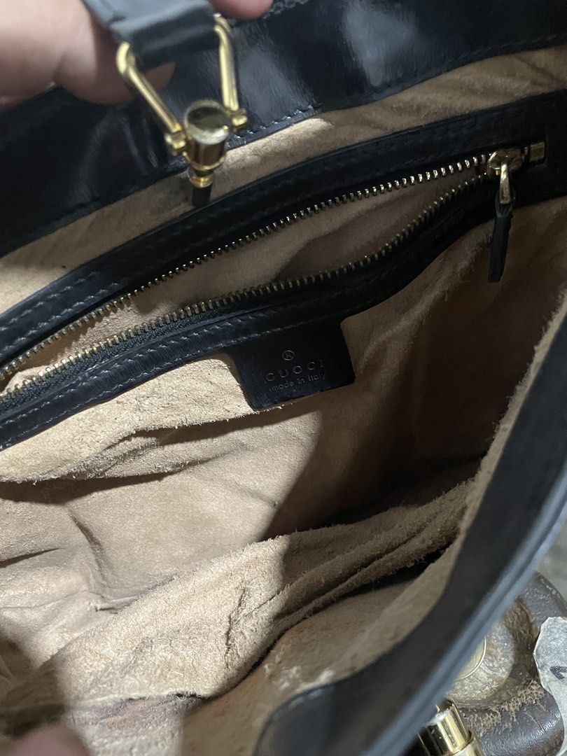 Gucci Jackie Black Leather Shoulder Bag (Category: Shoulder Bags) located in Santiago. Submitted by UkayLuxxSelector (Listing ID 1470051180, Image 3). Description: - Gucci Jackie shoulder bag in classic black leather - Iconic gold-tone piston hardware closure - Single comfortable leather strap - Clean beige suede interior lining with a secure zipped pocket - Serial number stamped on back of interior leather tag - Perfect everyday luxury statement
