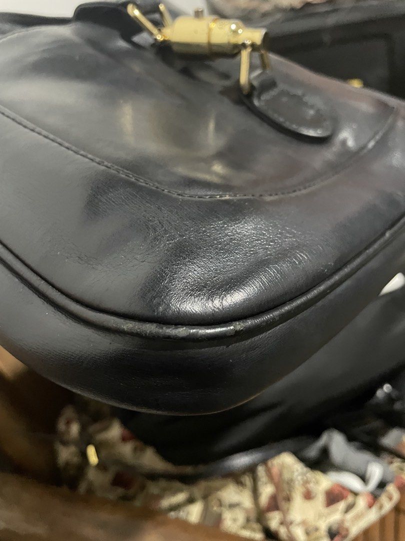 Gucci Jackie Black Leather Shoulder Bag (Category: Shoulder Bags) located in Santiago. Submitted by UkayLuxxSelector (Listing ID 1470051180, Image 2). Description: - Gucci Jackie shoulder bag in classic black leather - Iconic gold-tone piston hardware closure - Single comfortable leather strap - Clean beige suede interior lining with a secure zipped pocket - Serial number stamped on back of interior leather tag - Perfect everyday luxury statement