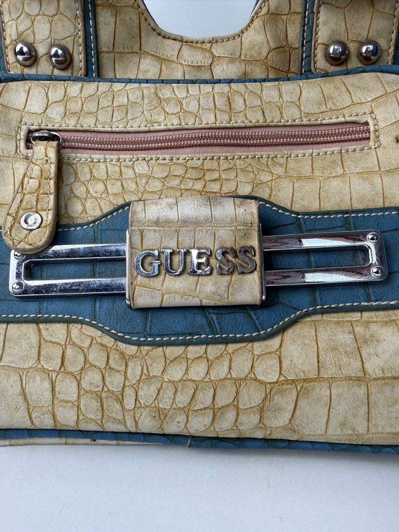 GUESS (Category: Luxury Bags & Wallets) located in Quezon City. Submitted by generalmerchandiseph (Listing ID 1470051815, Image 3). Description: STEAL 90’S - Y2K GUESS CROC SKIN 1500PHP ONLY 🔥 This is a vintage Y2K-era Guess faux-alligator/croc-embossed satchel handbag featuring teal and cream/beige trim with a front metal “GUESS” logo plate. Honest issue: need replacement zipper puller.