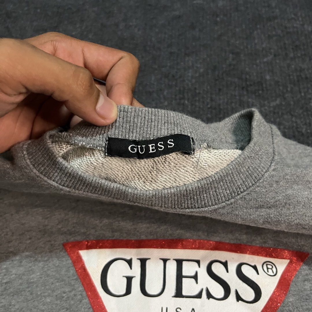 Guess Jeans Oversized Iconic Triangle Logo Sweatshirt (Category: Hoodies) located in Coron. Submitted by tr1p2thr1ft (Listing ID 1470038428, Image 3). Description: 21 by 25 No issue As new condition .