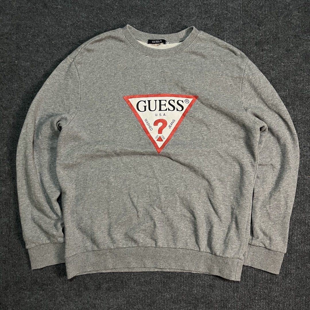 Guess Jeans Oversized Iconic Triangle Logo Sweatshirt (Category: Hoodies) located in Coron. Submitted by tr1p2thr1ft (Listing ID 1470038428, Image 1). Description: 21 by 25 No issue As new condition .